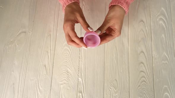 Close Up Menstrual Cup Silicone Girl Hands Holding Folding