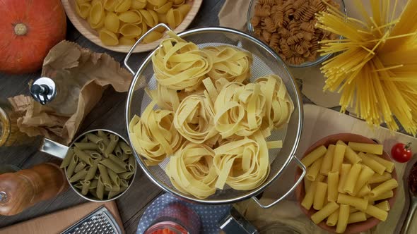 Dry Pasta Rolls and Ingredients for Making a Tomato Sauce.