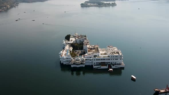 Aerial establishing shot of Taj lake palace, Udaipur. Lake Pichola, Udaipur, Rajasthan, India