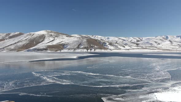 Frozen Water Surface of Lake Floe Melts in Spring