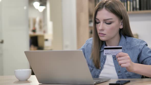 Online Shopping with Credit Card on Laptop By Young Girl