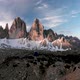 Aerial Man Hiker Walking In Front of Tre Cime di Lavaredo Mountain in Dolomites Italy - VideoHive Item for Sale