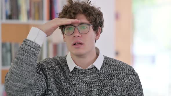 Portrait of Young Man Looking Around Searching