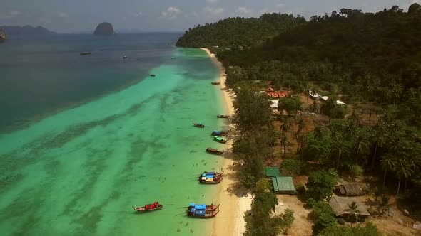 Aerial view of two traditional long tail boat moored in Chao Mai National Park in Thailand.