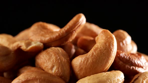 Video of cashews nut rotates slowly. Closeup shot in 4K resolution. Healthy food