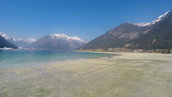 Low Water Level in Lake for Energy Saving During Off-Season at Alpine Ski Resort