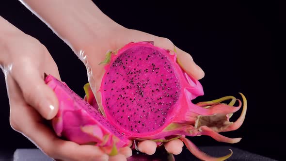 Cutting a Pitahaya Dragon Fruit in Female Hands