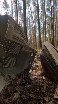 Vertical Video of the Computer in a Junkyard in the Forest Slow Motion