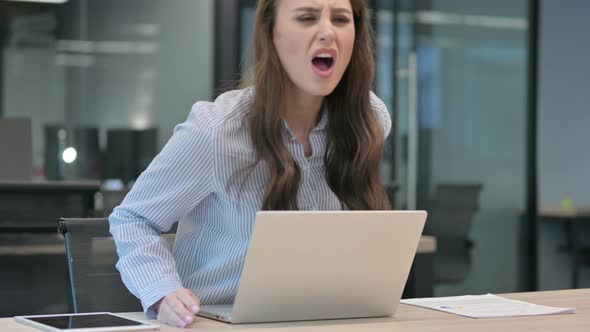 Young African Businessman with Laptop having Back Pain