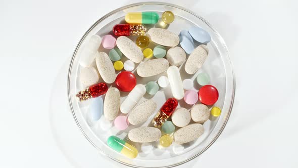 Colorful Medical Pills Rotating Closeup on White Background