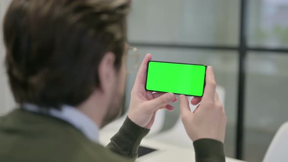 Businessman Looking at Smartphone with Chroma Screen
