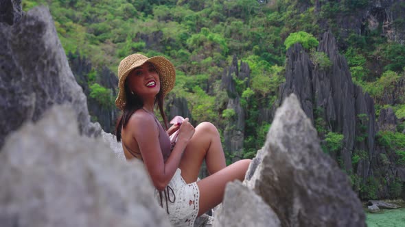 Smiling Young Woman In Sun Hat On Limestone Rocks