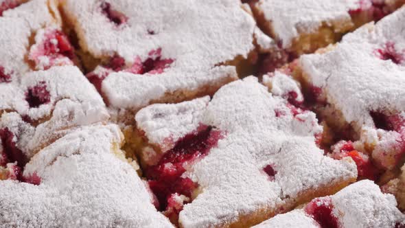 Cherry cake sliced on pieces close-up 4K 3840X2160 UHD video - Pieces on tasty cherry cake iced with