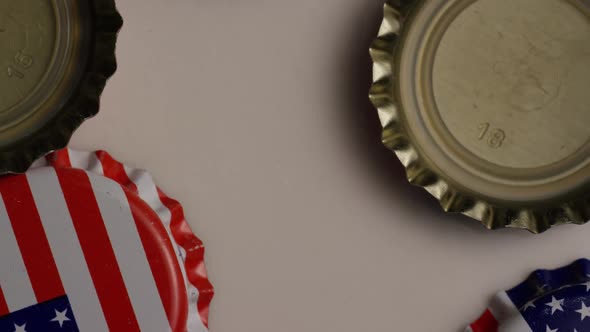 Rotating shot of bottle caps with the American flag printed on them - BOTTLE CAPS 