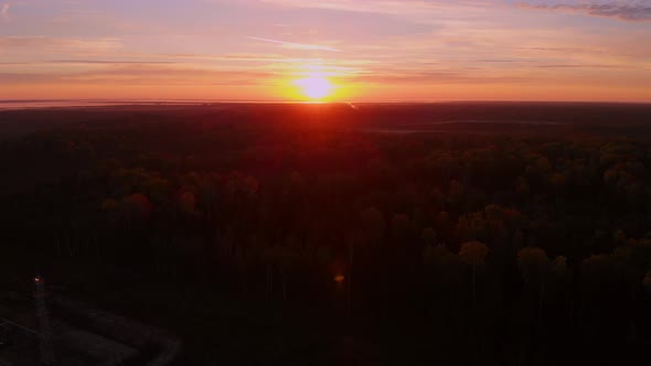 Bright Sunset Over the Horizon in the Tundra Where Oil and Gas are Extracted