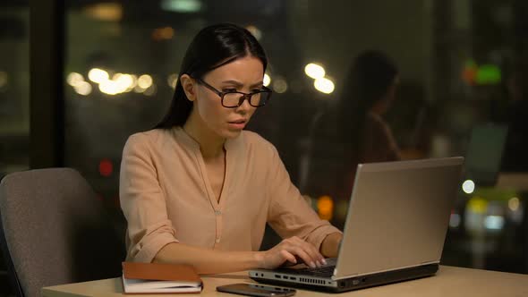 Female Employee Suffers Eye Strain and Headache When Using Laptop, Overwork
