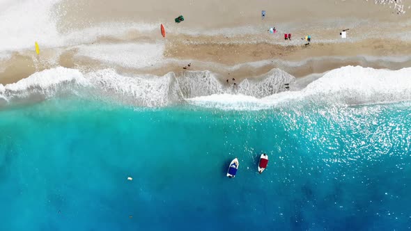 Splashing sea waves and beach.