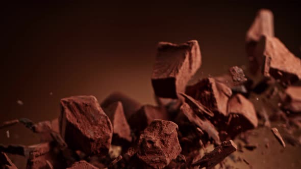 Super Slow Motion Shot of Raw Chocolate Pieces and Cocoa Powder After Being Exploded at 1000Fps