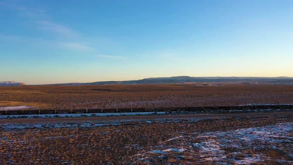 Desert and Freight Train at Sunset in Winter