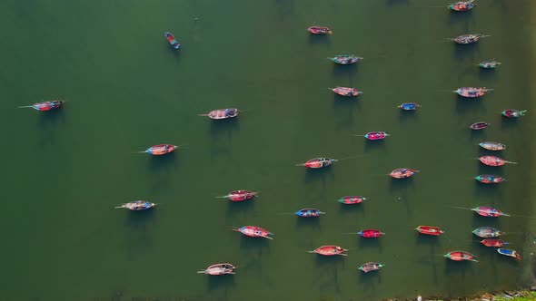 Many fishing boats on the coast beside the mountains, beautiful sea area in Thailand.