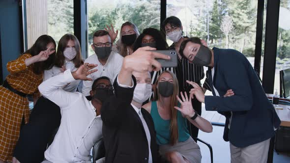 Group of Happy Young Multiethnic Business People Smile Posing Together for Smartphone Selfie Photo