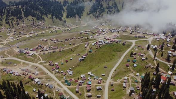 Misty Aerial View Of High Mountain Village