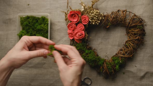 Female Hands Makes Floral Wreath