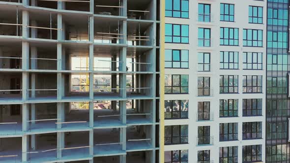 Many windows on new apartment building facade under construction