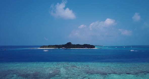 Tropical fly over abstract view of a sandy white paradise beach and blue water background