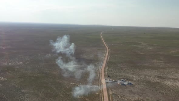 Plains And Road With Smoke Aerial View