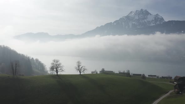 Aerial view of beautiful mountains with clouds in winter, Lucerne, Switzerland.