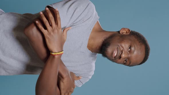 Vertical Video Portrait of African American Man Posing with Arms Crossed