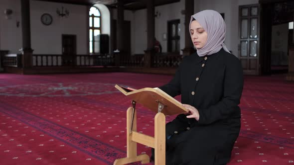 Muslim Girl Reading Quran In Mosque