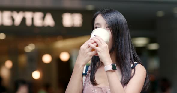 Woman drinking of fruit tea