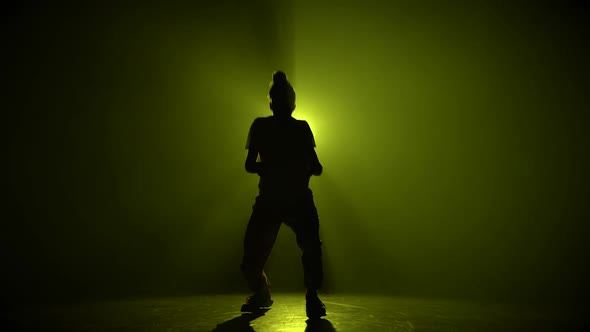 Silhouette Young Man Dancing Single in Club, Neon Light, Lots of Smoke. Fashion Street Wear