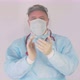 Doctor in personal protective equipment clapping their hands to cerebrate the success of treatment. - VideoHive Item for Sale
