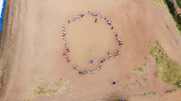 African School Playground, Kids Standing in Circle and Playing Game, Aerial View