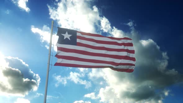 Flag of Liberia Waving at Wind Against Beautiful Blue Sky