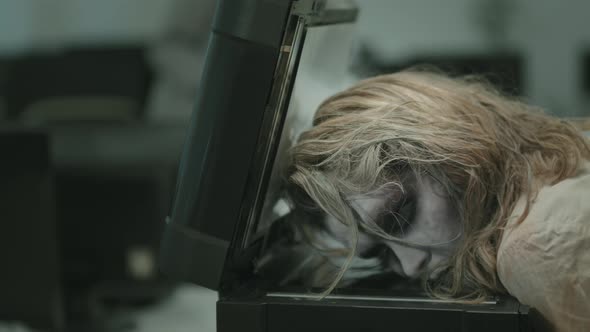 Zombie Woman Lying on Copier