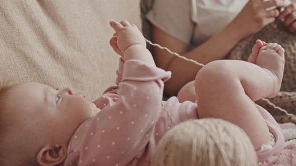 Baby Playing with Yarn