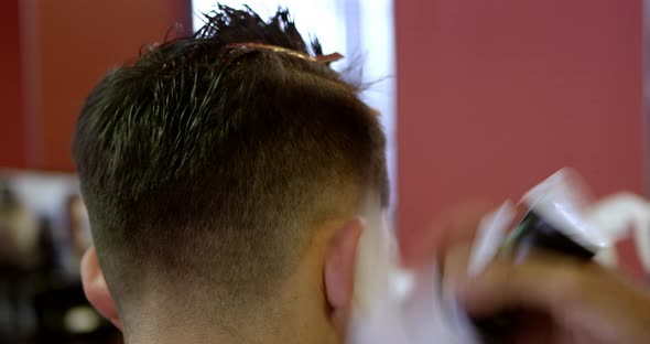 Man Getting His Hair Trimmed with Scissor 4k