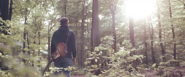 Guitar Player in the Woods