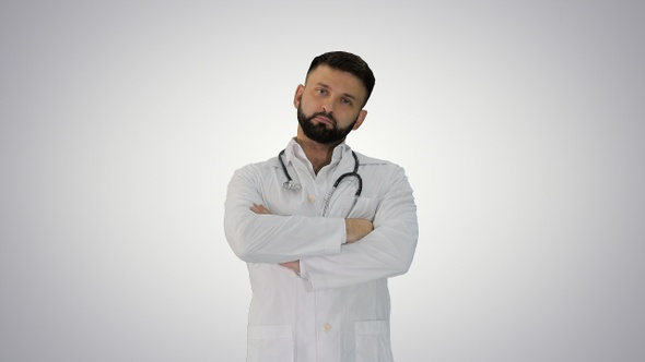 Young Male Caucasian Doctor Standing with Folded Hands