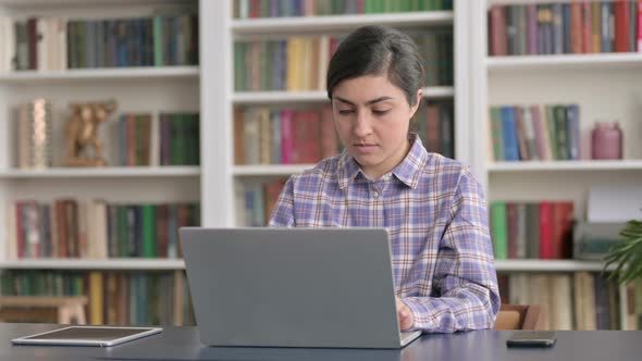 Indian Woman Working on Laptop in Office