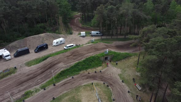 Motorcycles on motocross terrain in the forest in Halle, The Netherlands