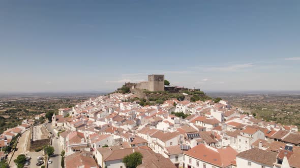 Aerial orbiting over Castelo de vide white houses village, hilltop Castle - Alentejo