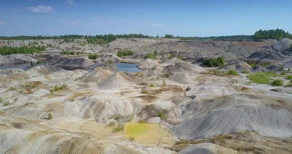 Aerial View White Clear Hills Near Lake in Spent Clay Quarry