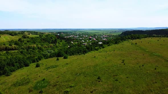 Aerial drone view of a flying over the rural agricultural landscape.