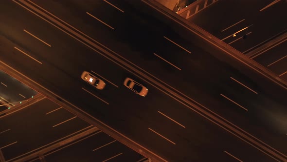 Aerial Top View of Highway Interchange at Night