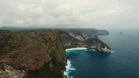 Rocky Cliff with Beach in the Sea